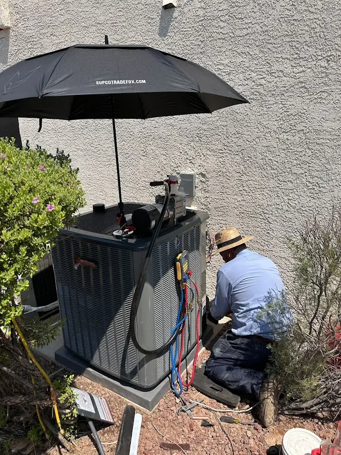 HVAC technician performing outdoor AC maintenance in Bushkill